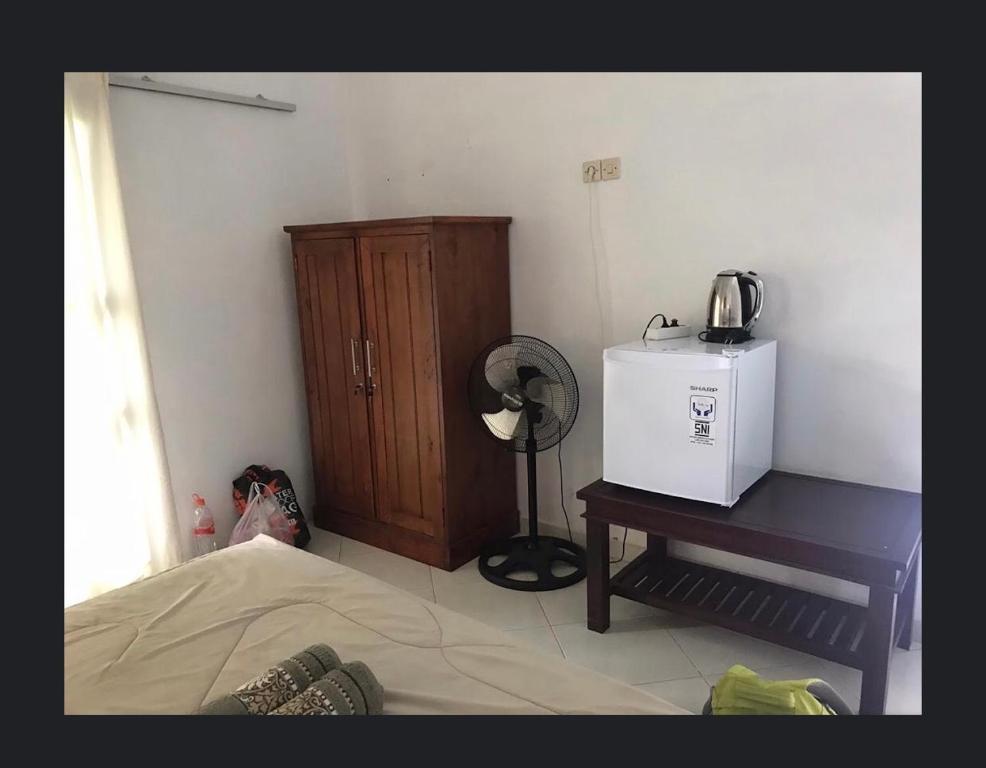 Postel nebo postele na pokoji v ubytování Sugi Gede Homestay