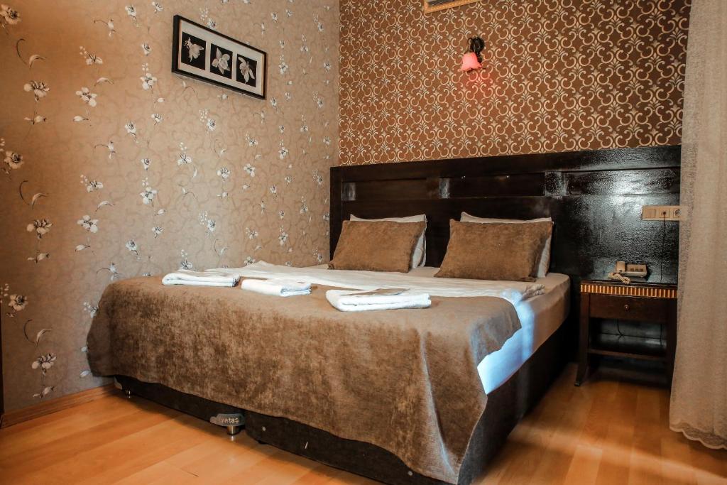Ένα ή περισσότερα κρεβάτια σε δωμάτιο στο Letter Hotel