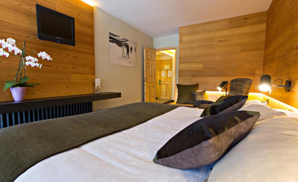 Postel nebo postele na pokoji v ubytování Hotel La Coma
