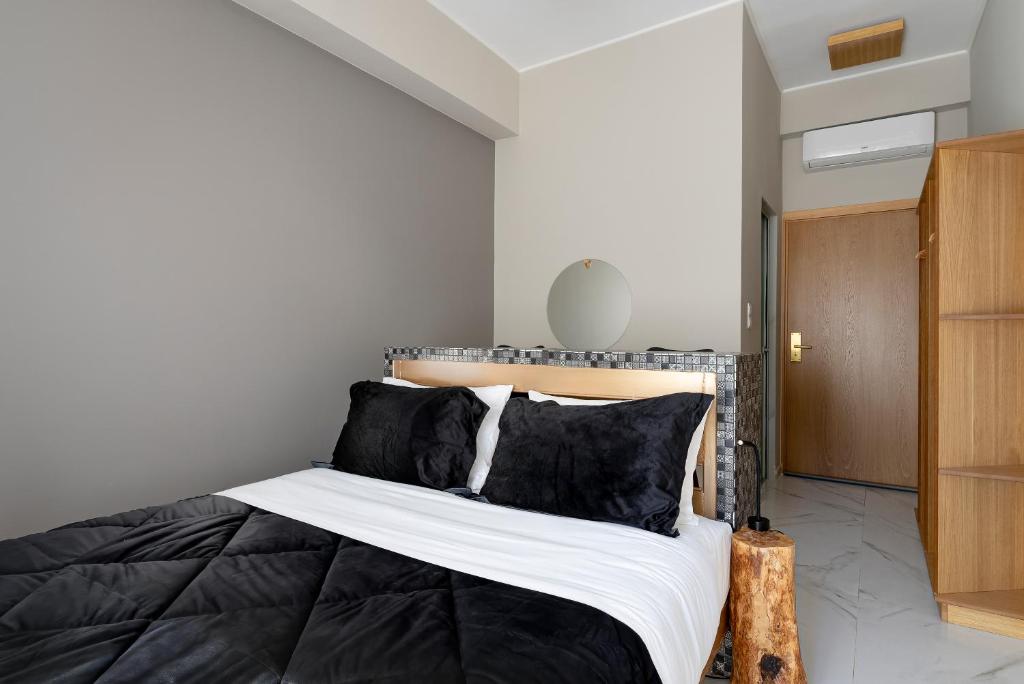 Postel nebo postele na pokoji v ubytování Kipos Hotel