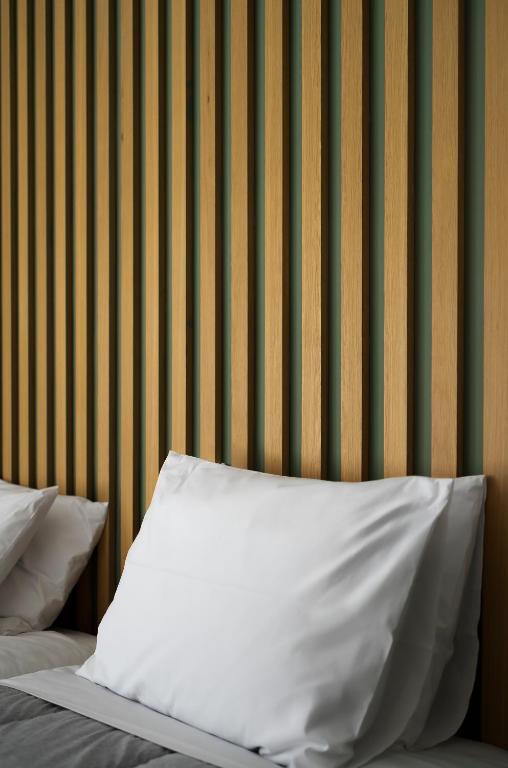 Postel nebo postele na pokoji v ubytování Kipos Hotel