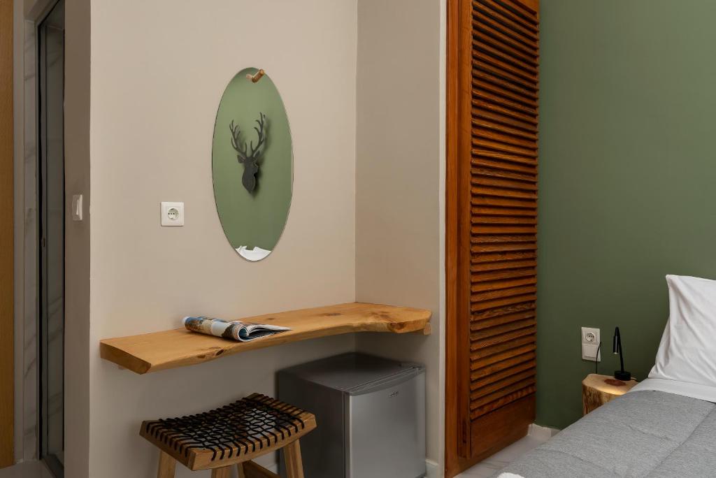 Postel nebo postele na pokoji v ubytování Kipos Hotel