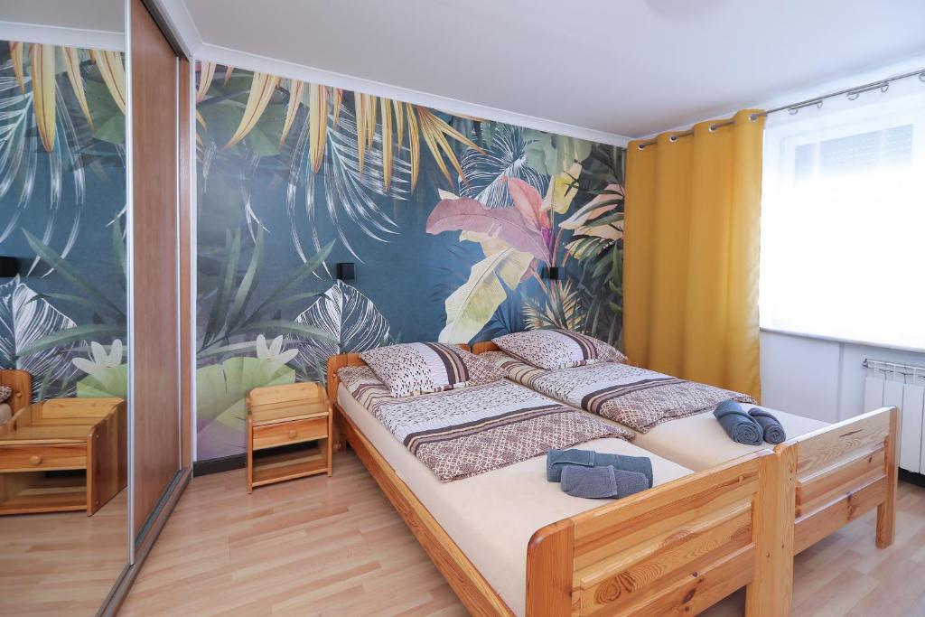 Posteľ alebo postele v izbe v ubytovaní Apartamenty Częstochowa