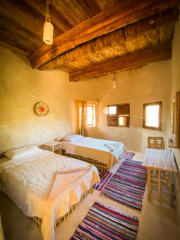 Postel nebo postele na pokoji v ubytování Sleep In Siwa