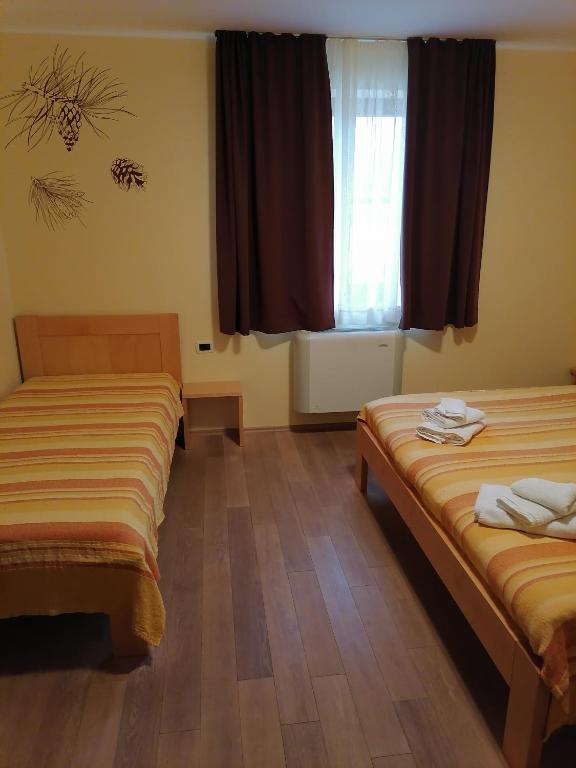 Postel nebo postele na pokoji v ubytování Homestead Vrbin