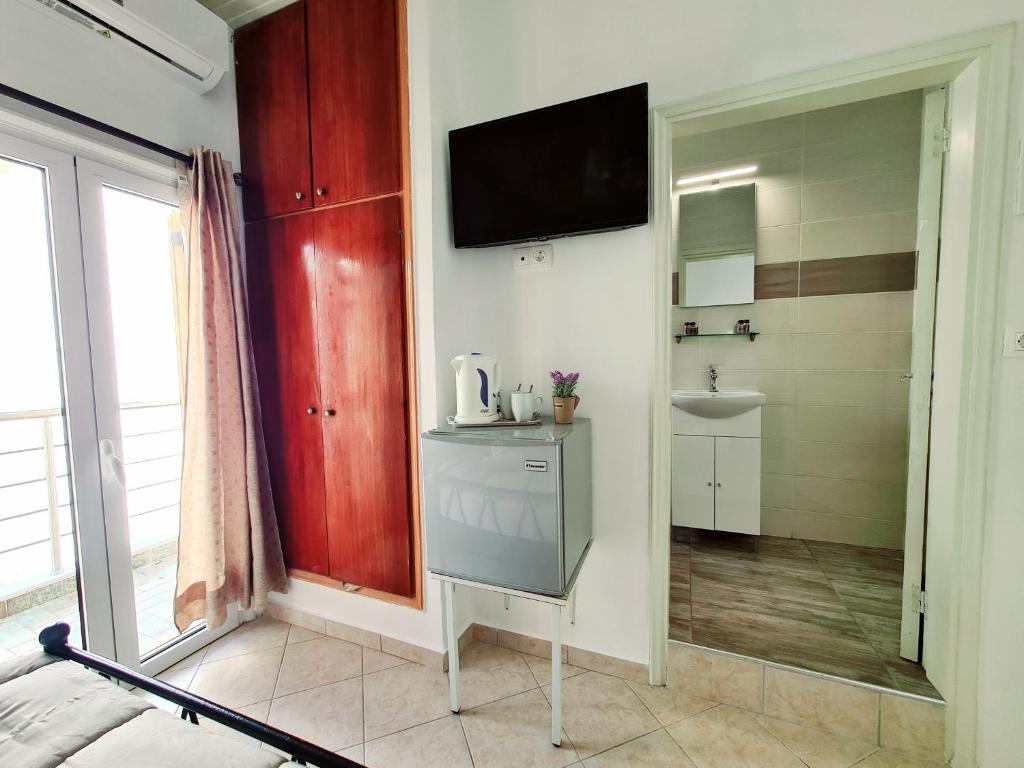 Kuchyň nebo kuchyňský kout v ubytování Avra Rooms
