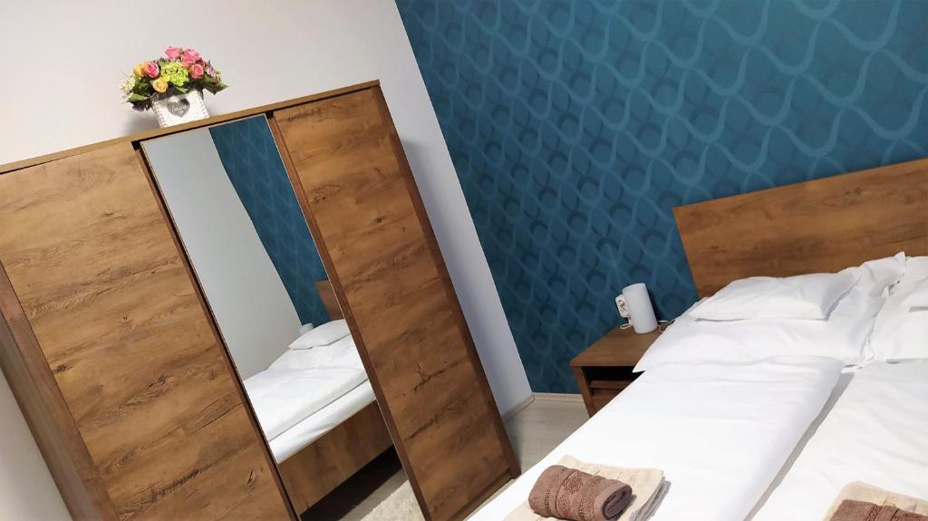 Posteľ alebo postele v izbe v ubytovaní Müezzin Apartman
