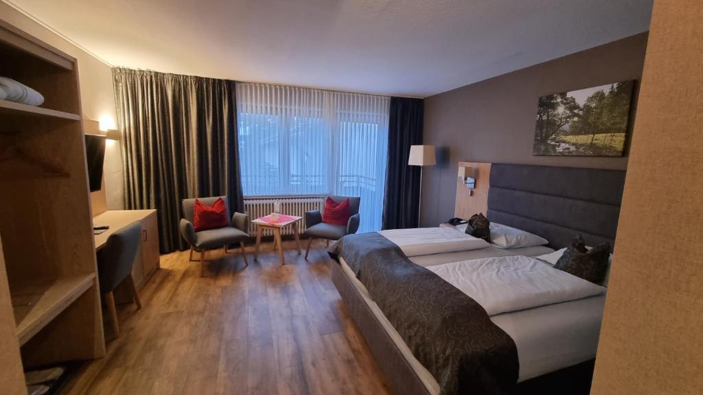 Postel nebo postele na pokoji v ubytování Sporthotel Zum Hohen Eimberg