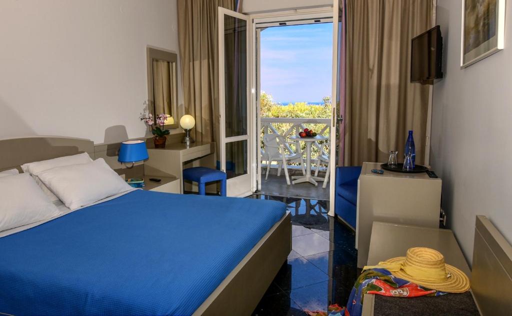 Postel nebo postele na pokoji v ubytování Mantenia Hotel