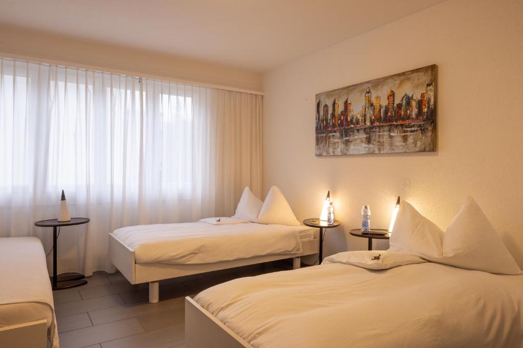 Postel nebo postele na pokoji v ubytování Hotel Bären Niederscherli