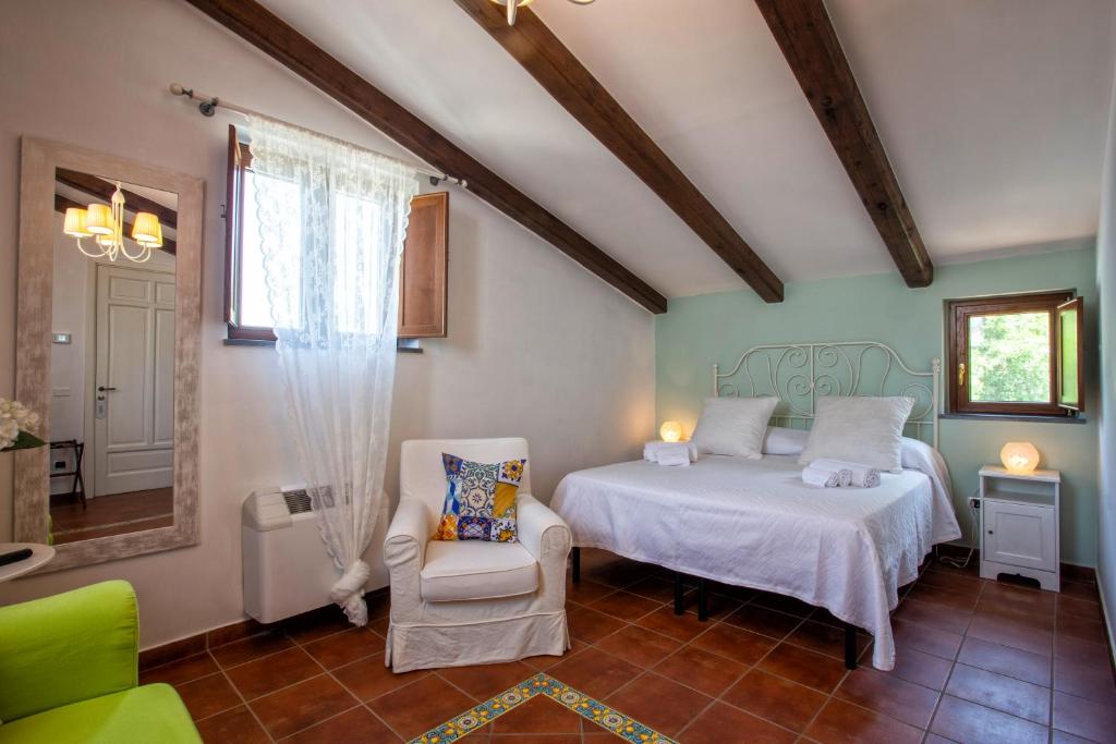 Postel nebo postele na pokoji v ubytování Agriturismo Il Convento