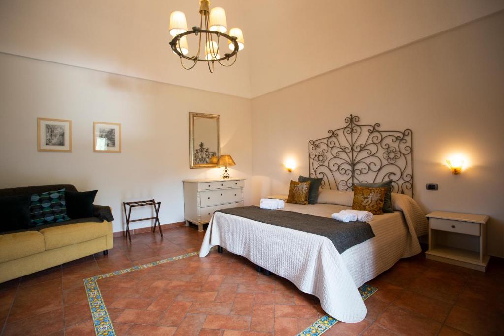 Postel nebo postele na pokoji v ubytování Agriturismo Il Convento