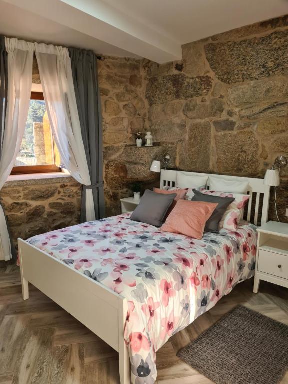 Postel nebo postele na pokoji v ubytování Casa Veiga 1