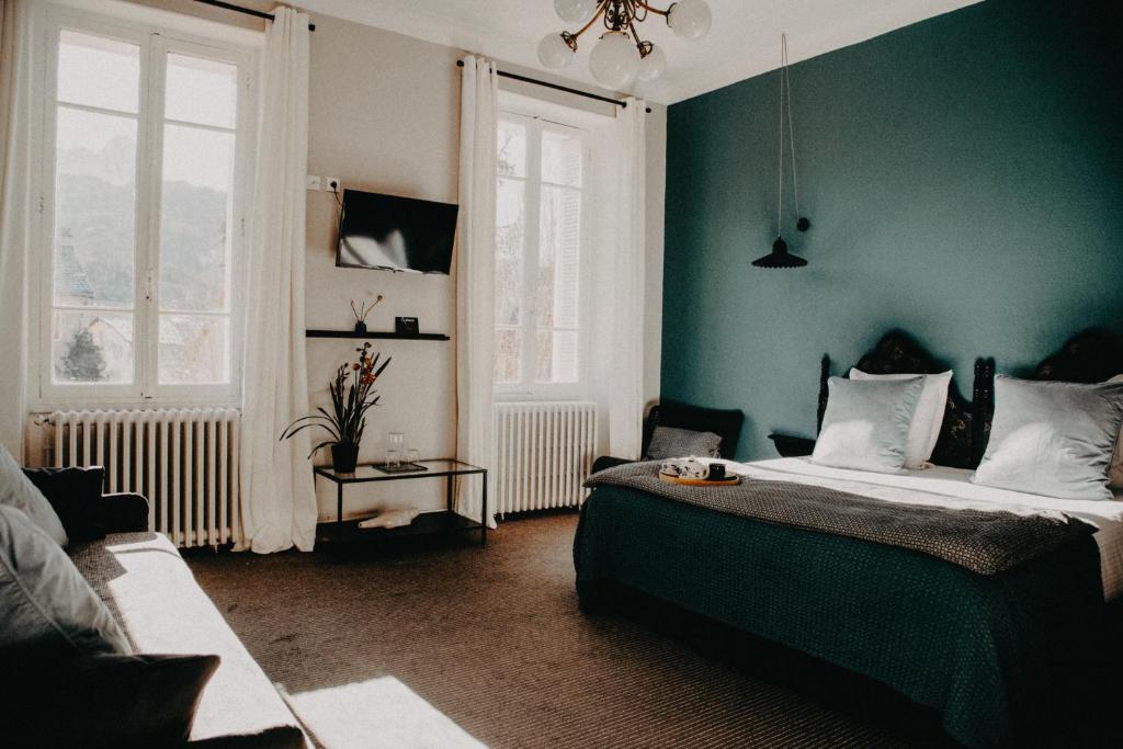 Postel nebo postele na pokoji v ubytování Hotel Spa Azteca Barcelonnette