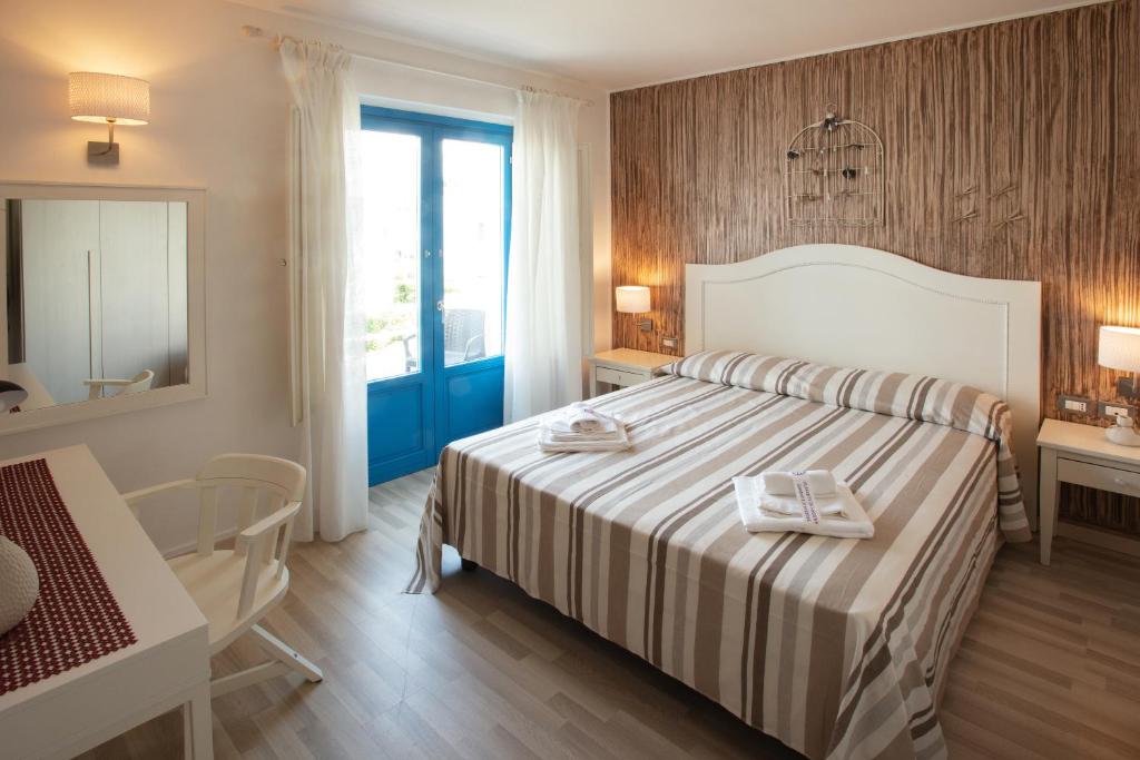 Кровать или кровати в номере Holidays In Sicily