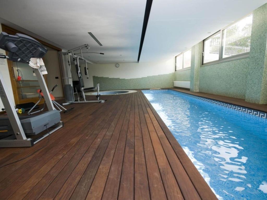 The swimming pool at or close to Belvilla by OYO Sammy