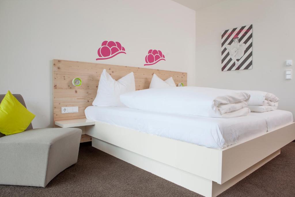 Postel nebo postele na pokoji v ubytování Hotel Die Alm