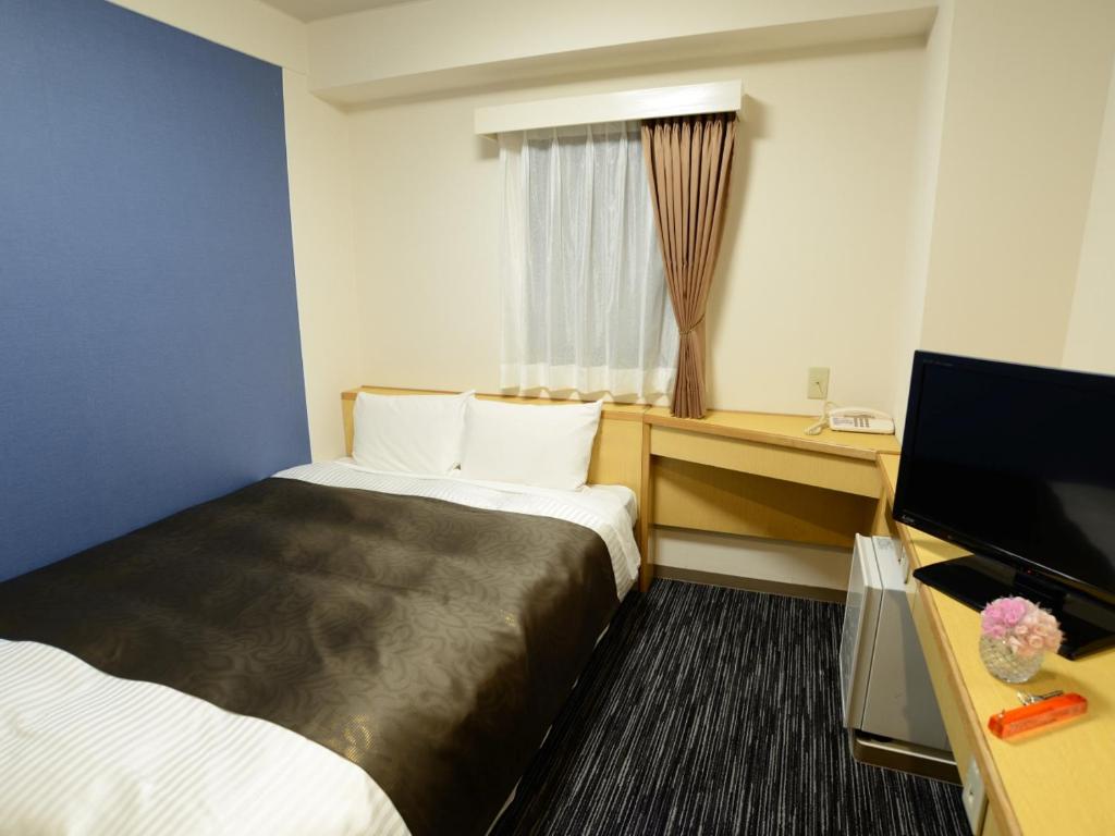 Krevet ili kreveti u jedinici u okviru objekta Nagoya Sakae Green Hotel