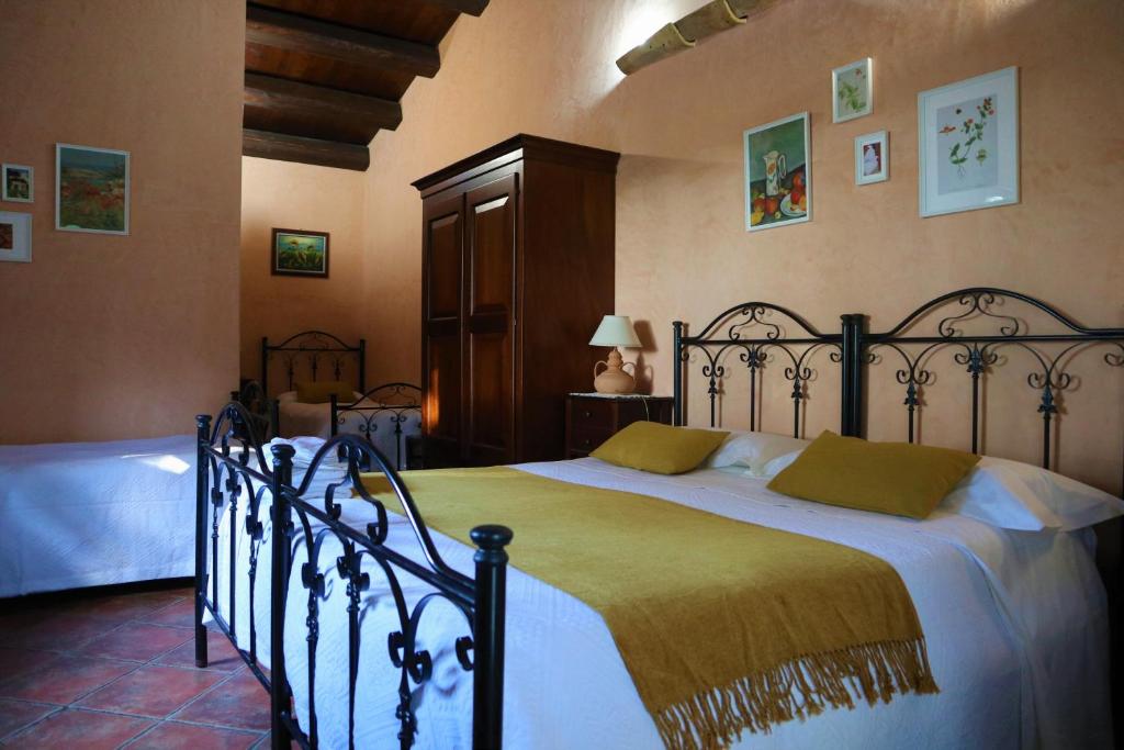 Postel nebo postele na pokoji v ubytování B&B Villa Giusy