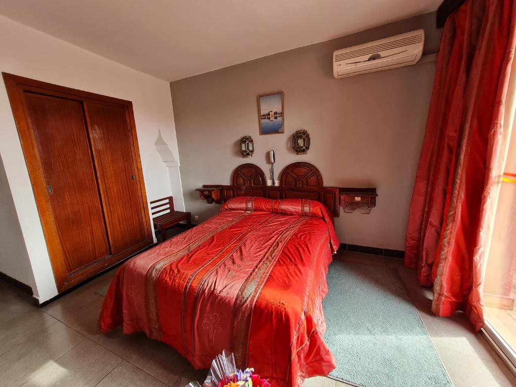 Postel nebo postele na pokoji v ubytování Hotel Tachfine