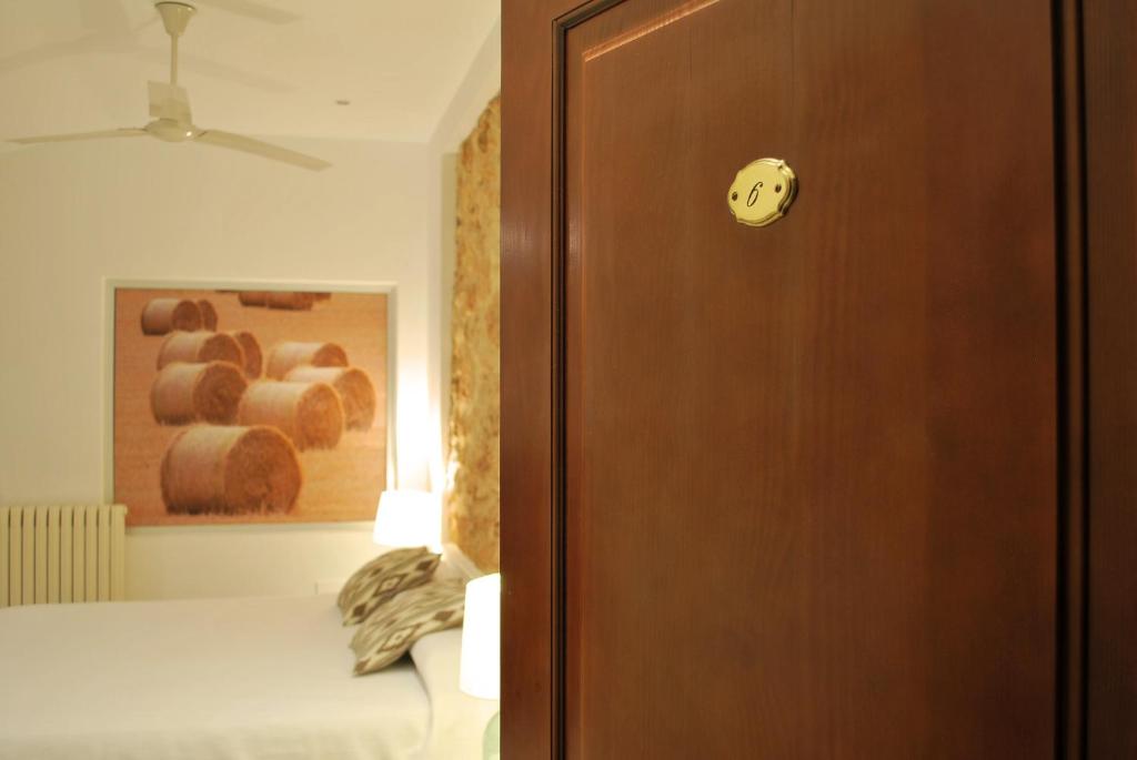Postel nebo postele na pokoji v ubytování PETIT HOTEL ALGAIDA