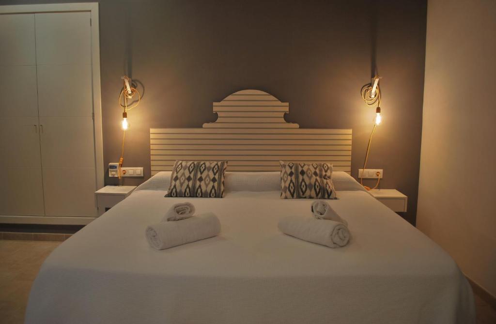 Postel nebo postele na pokoji v ubytování PETIT HOTEL ALGAIDA