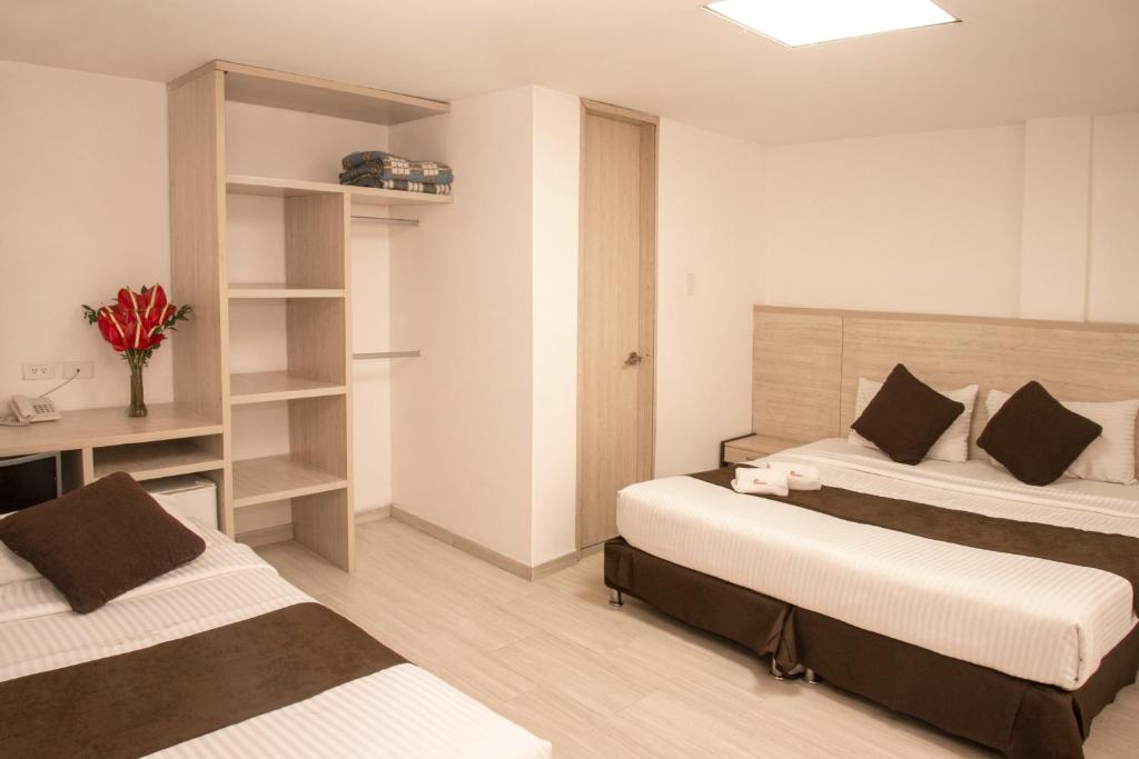 Postel nebo postele na pokoji v ubytování Hotel Bestmark Platino en Chapinero Bogota