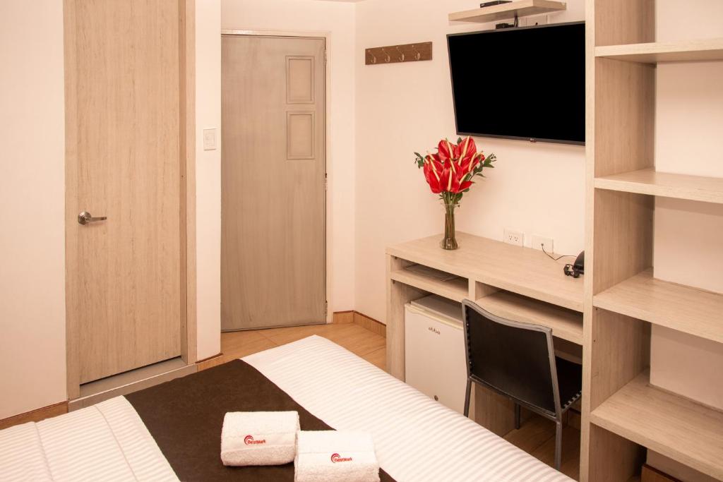 TV a/nebo společenská místnost v ubytování Hotel Bestmark Platino en Chapinero Bogota