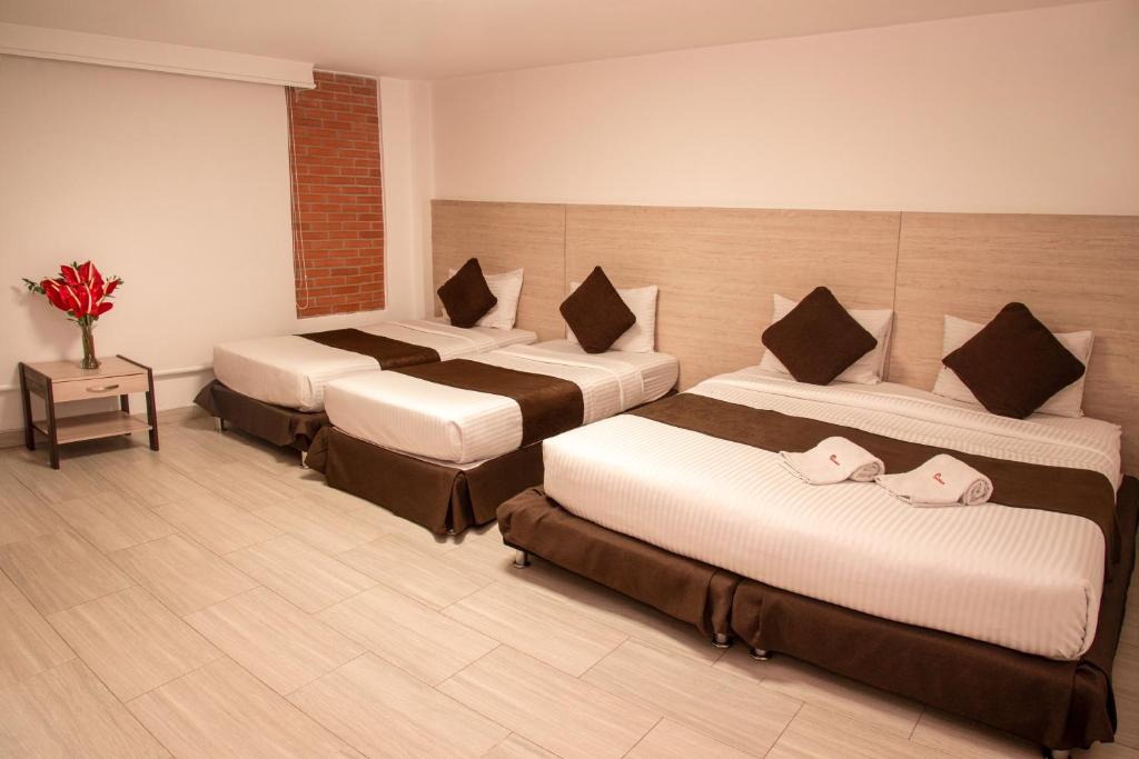 Postel nebo postele na pokoji v ubytování Hotel Bestmark Platino en Chapinero Bogota