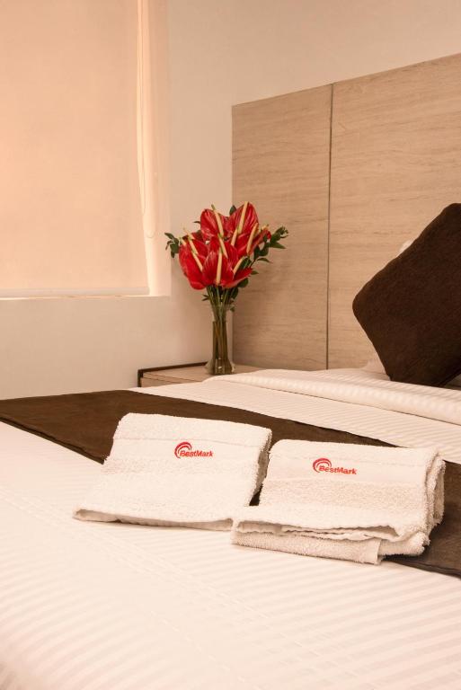 Postel nebo postele na pokoji v ubytování Hotel Bestmark Platino en Chapinero Bogota