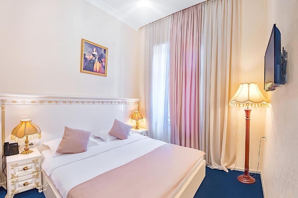 Postel nebo postele na pokoji v ubytování Vintage Hotel