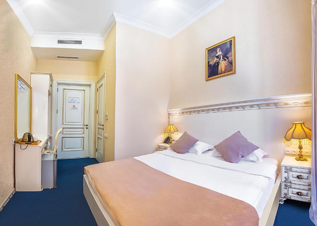Postel nebo postele na pokoji v ubytování Vintage Hotel