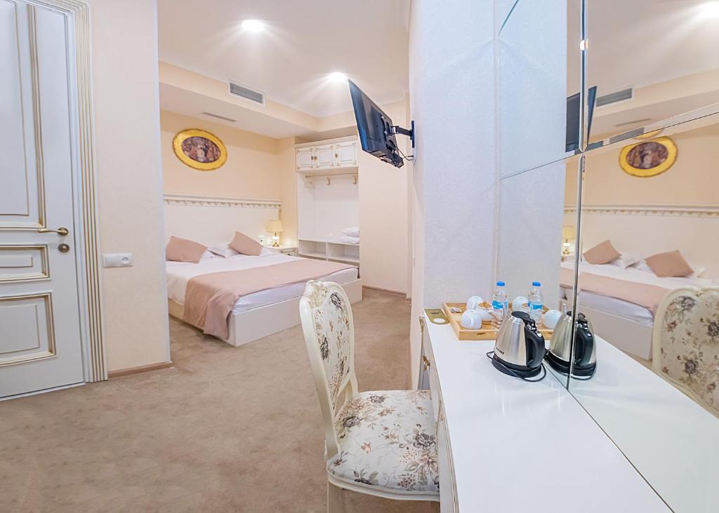 Postel nebo postele na pokoji v ubytování Vintage Hotel