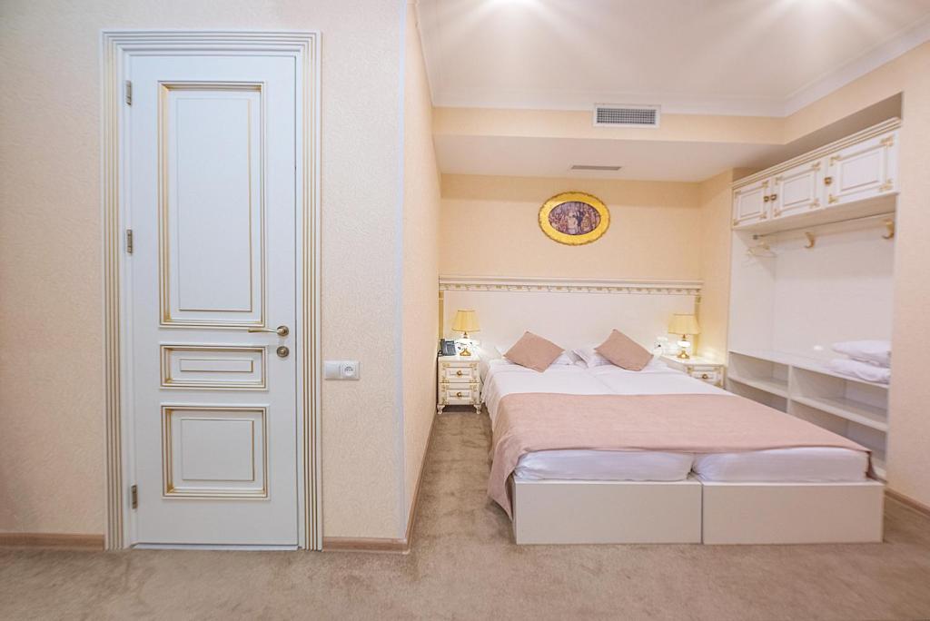 Postel nebo postele na pokoji v ubytování Vintage Hotel
