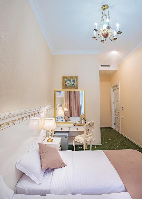Postel nebo postele na pokoji v ubytování Vintage Hotel