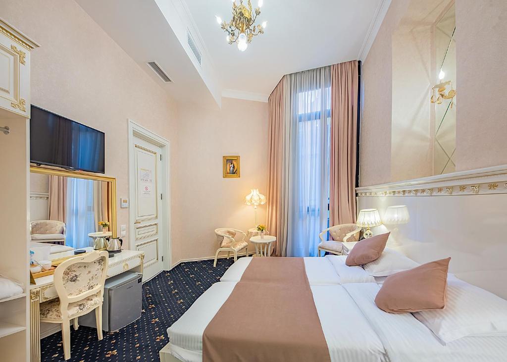 Postel nebo postele na pokoji v ubytování Vintage Hotel