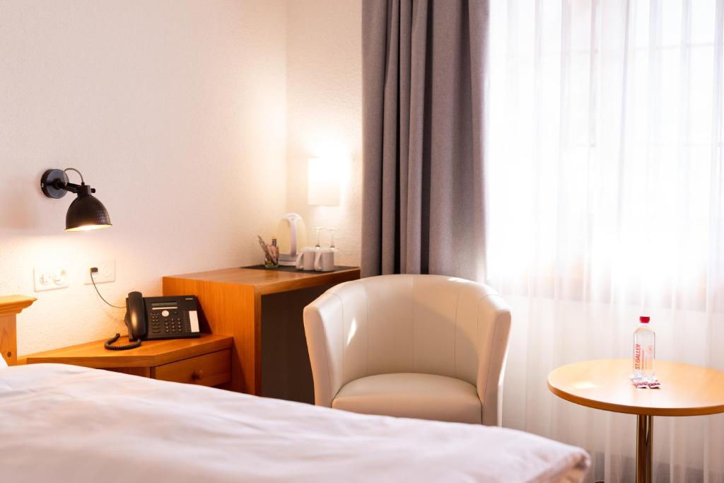 Postel nebo postele na pokoji v ubytování Hotel Schatzmann
