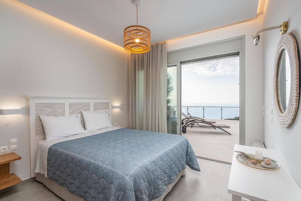 Postel nebo postele na pokoji v ubytování Owl Villas