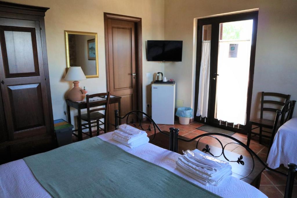 Postel nebo postele na pokoji v ubytování B&B Villa Giusy