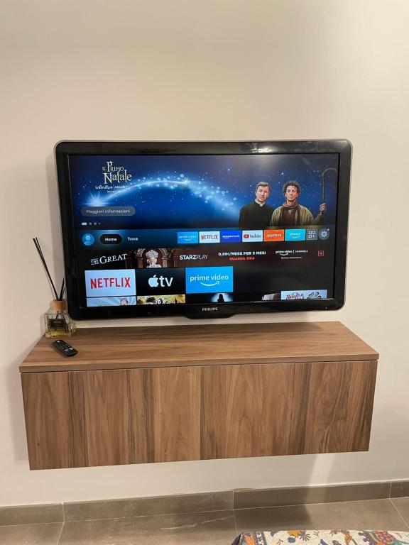 Televízia a/alebo spoločenská miestnosť v ubytovaní CASA KHRIS