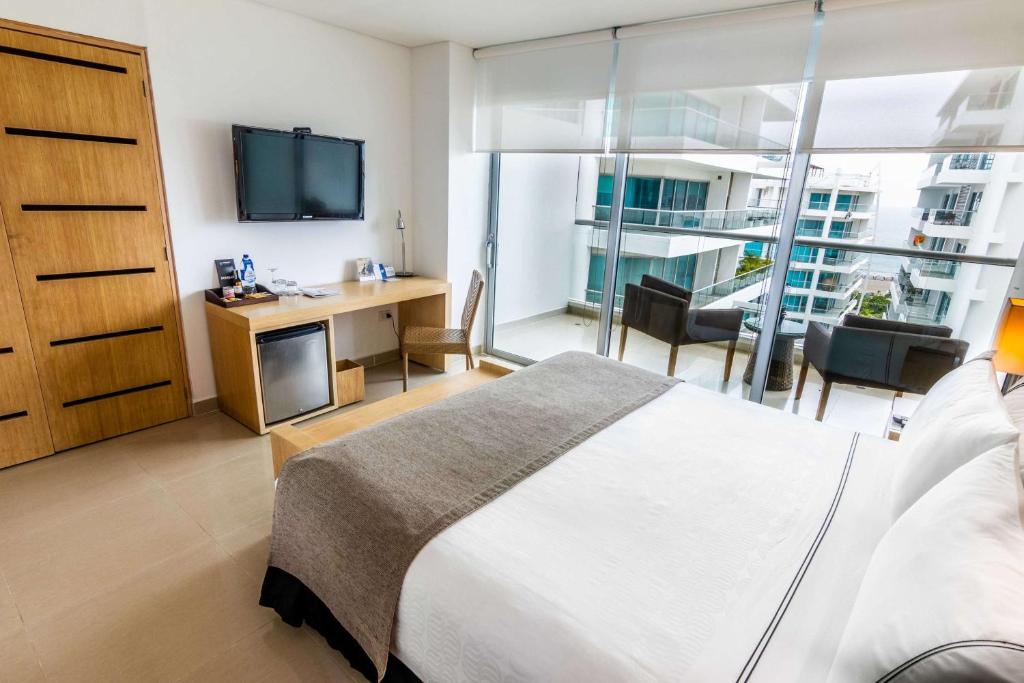 Postel nebo postele na pokoji v ubytování Sonesta Hotel Cartagena