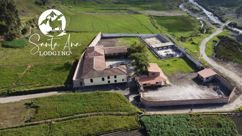 an aerial view of a large house in a field at Hacienda Santa Ana Lodging in Guamote