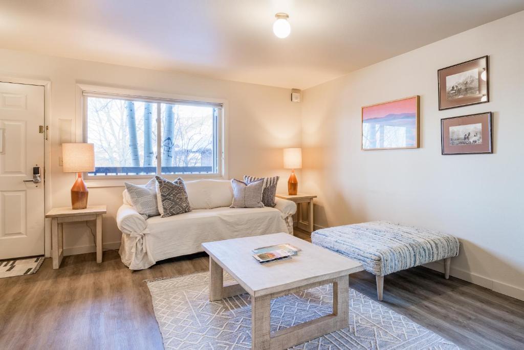 a living room with a couch and a table at 2401 Pitchfork in Jackson