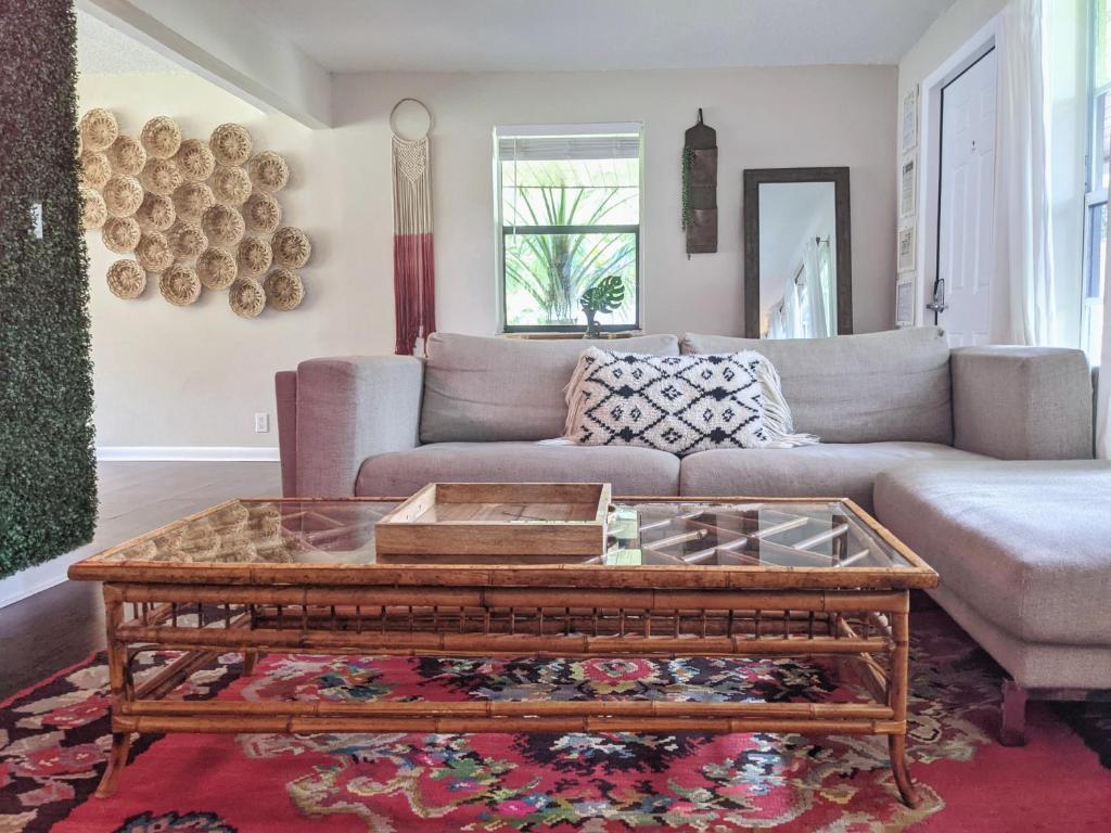 a living room with a couch and a coffee table at The Place in Fort Lauderdale