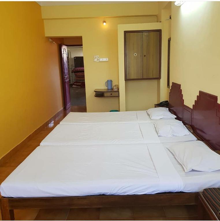 Postel nebo postele na pokoji v ubytování The Sincro Hotel