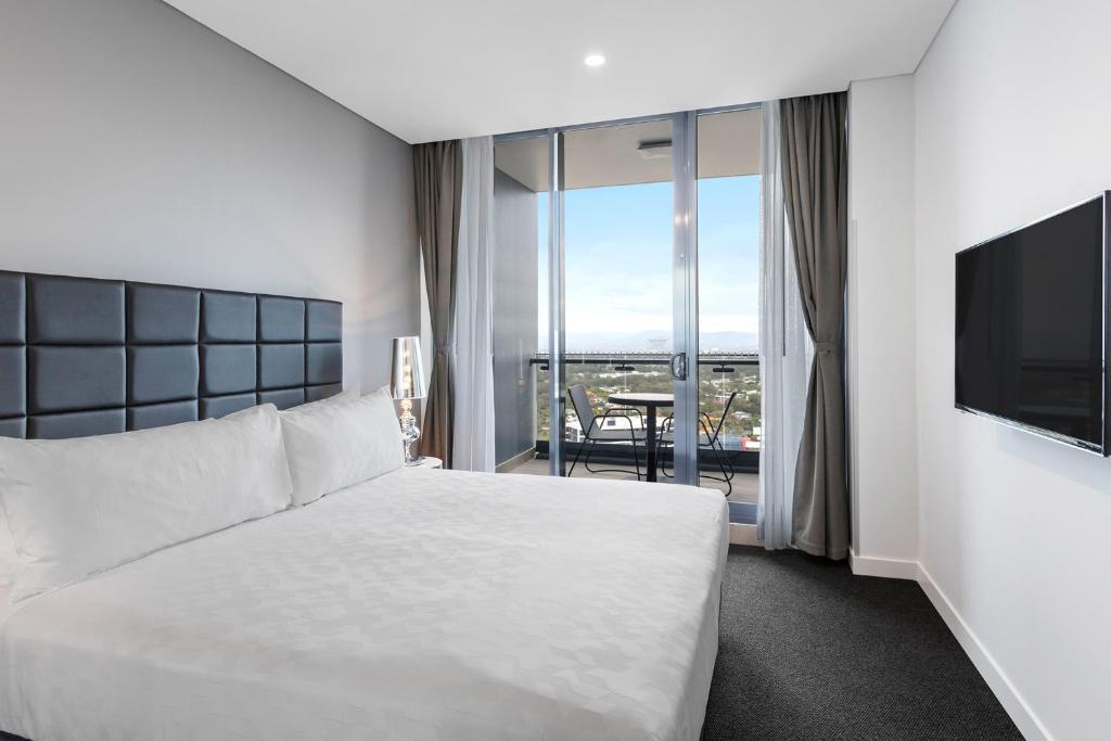 Postel nebo postele na pokoji v ubytování Meriton Suites Southport