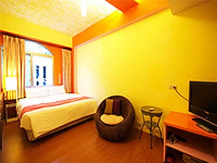 Postel nebo postele na pokoji v ubytování Fei Li Jin Hotel