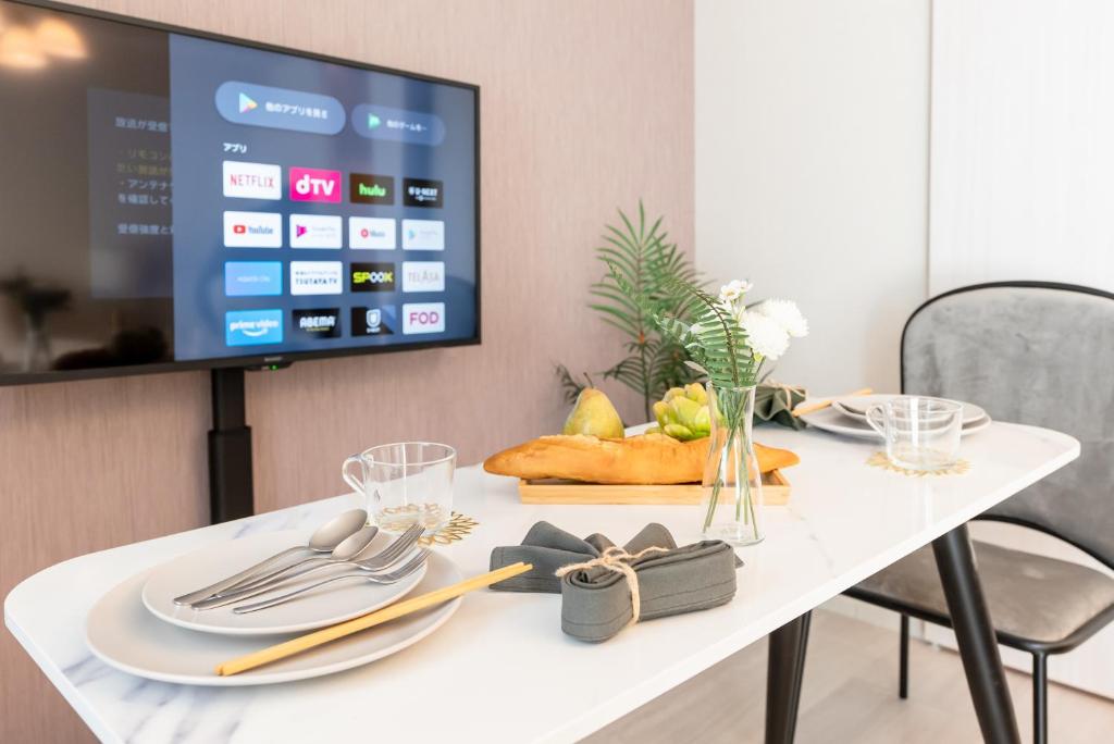 TV a/nebo společenská místnost v ubytování 谷町君 HOTEL 日本橋47