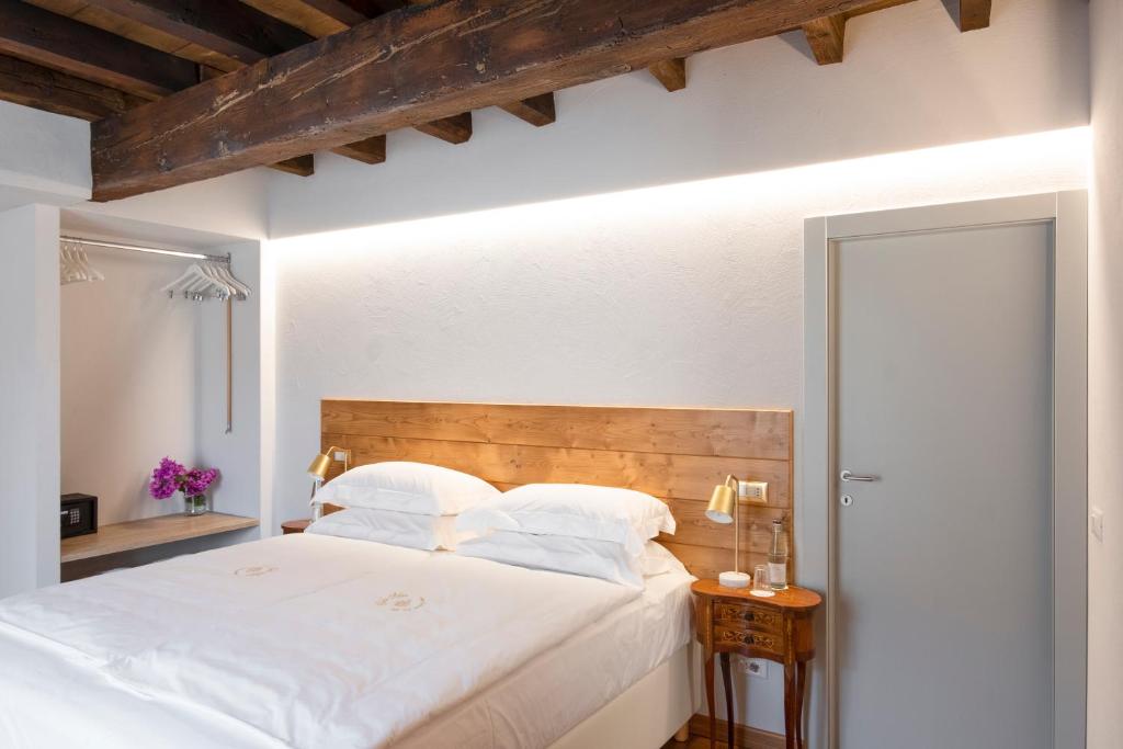 Postel nebo postele na pokoji v ubytování Corte Alma Spa and Luxury Home
