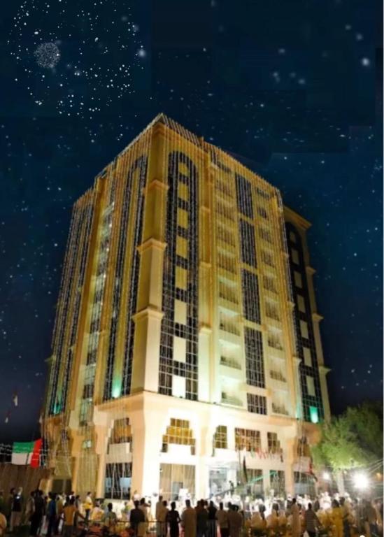 a large building with people standing in front of it at Royal View Hotel in Ras al Khaimah